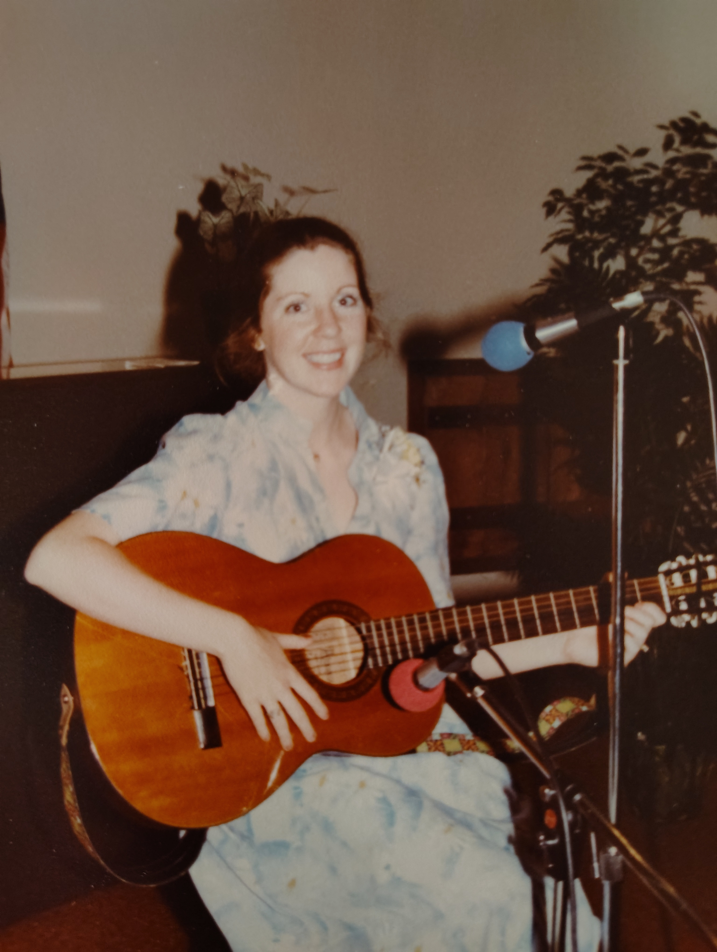 Singing with her guitar