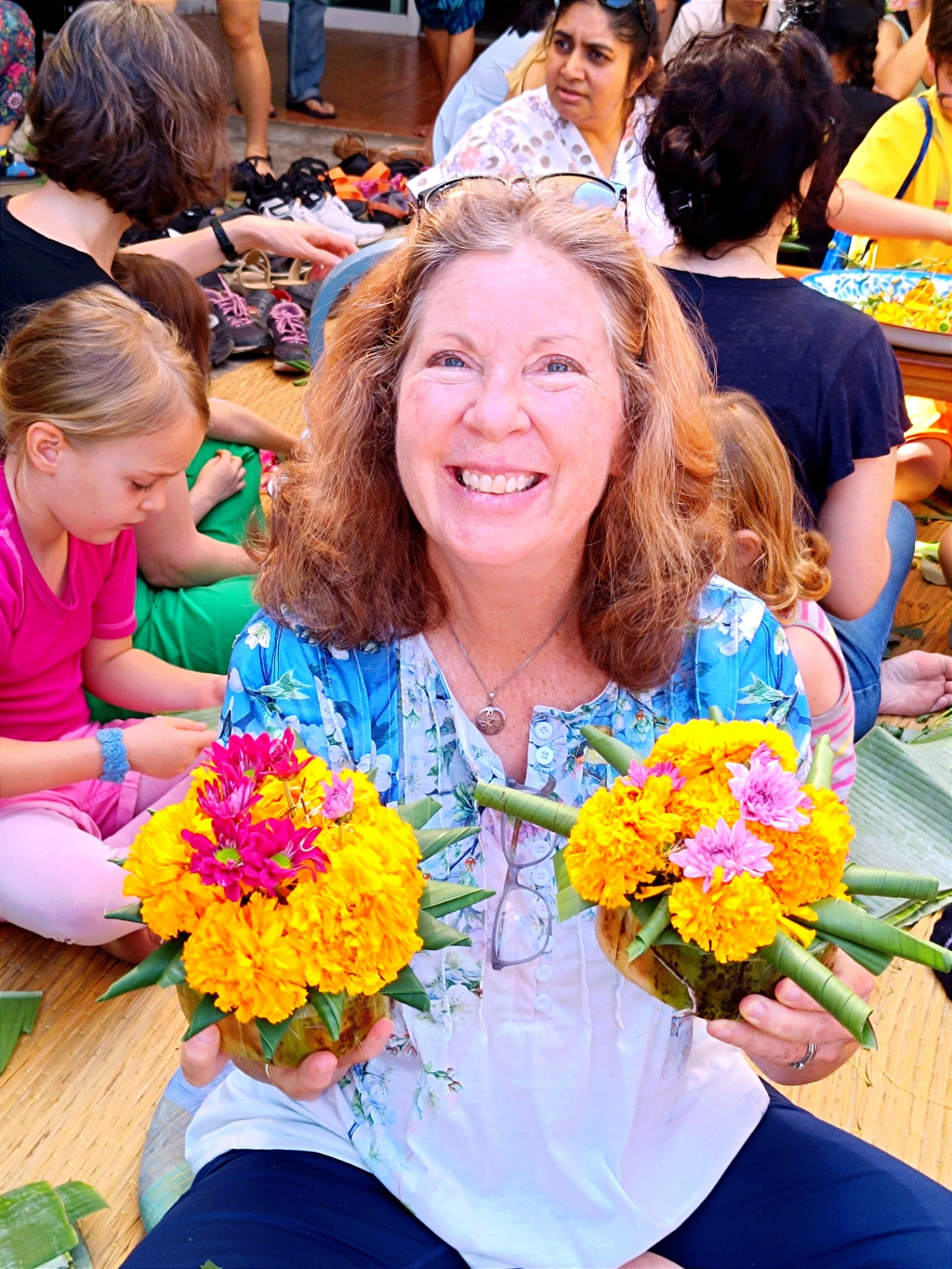 Holding flower offerings in Thailand